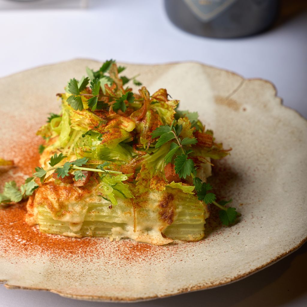 Gratinated Celery in Carpione, Béchamel with Aged Asiago DOP, and Vegetable Garnishes